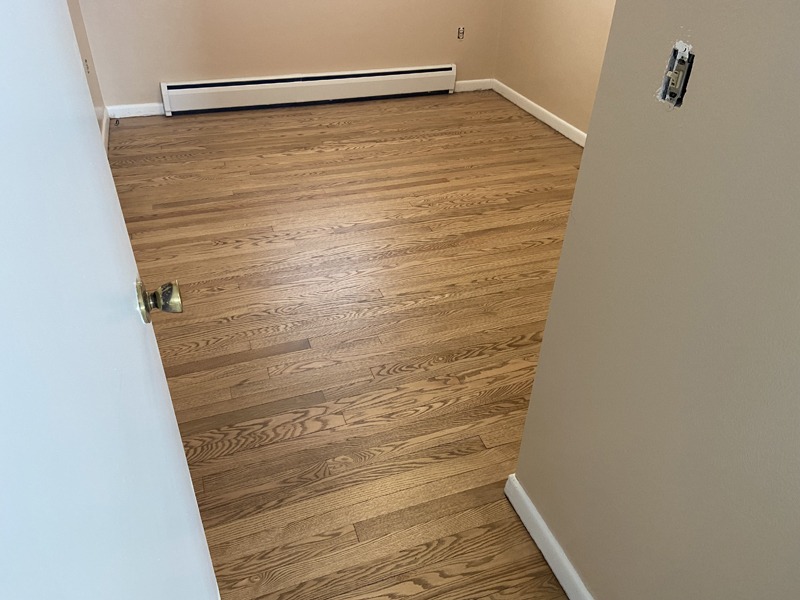 Restored and Refinished Hardwood Floor