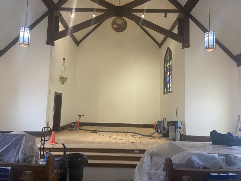 Church floor refinishing with protective tarps and dust collection
